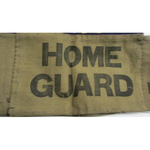 1167 - An original WW2 home guard arm band and four fire guard arm band of indeterminate age.