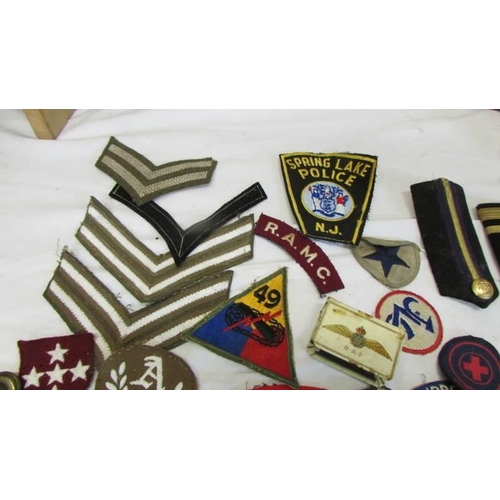 1168 - A large collection of military and other cloth badges including Kenya air force, honor guard, scouts... 