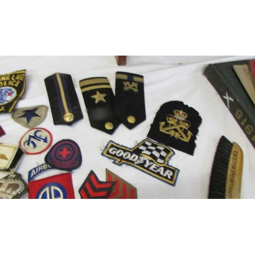 1168 - A large collection of military and other cloth badges including Kenya air force, honor guard, scouts... 