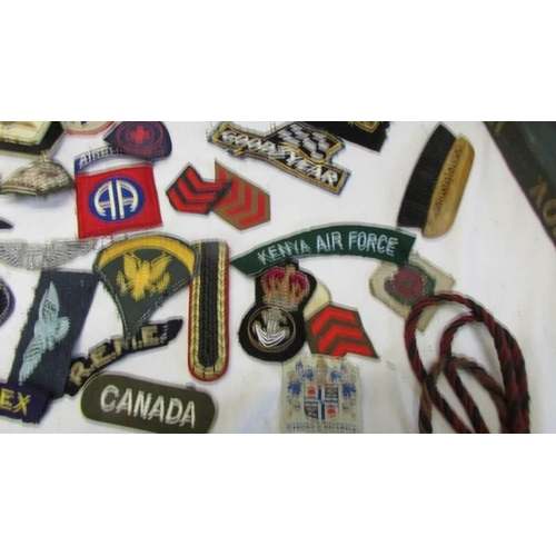 1168 - A large collection of military and other cloth badges including Kenya air force, honor guard, scouts... 