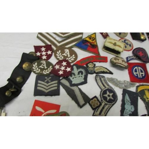 1168 - A large collection of military and other cloth badges including Kenya air force, honor guard, scouts... 