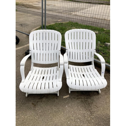 211 - A pair of white garden loungers