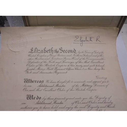 1173 - An MBE certificate of Major Joseph Morris Hall signed by Queen Elizabeth II and Prince Phillip with ... 