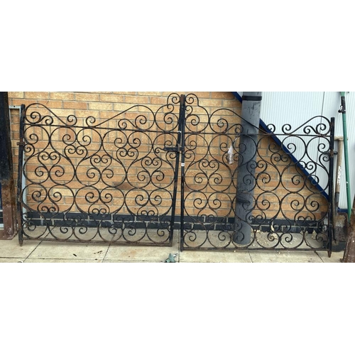 148 - A pair of wrought iron gates & posts Height 133cm x Width 260cm