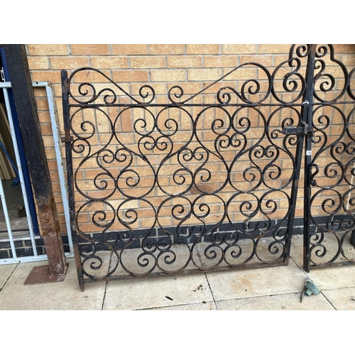 148 - A pair of wrought iron gates & posts Height 133cm x Width 260cm