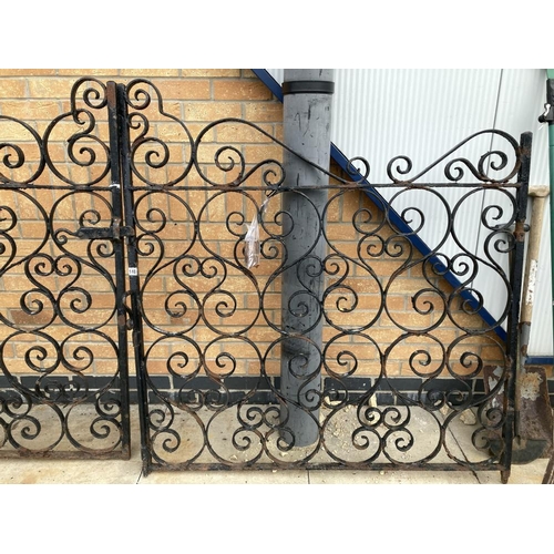 148 - A pair of wrought iron gates & posts Height 133cm x Width 260cm