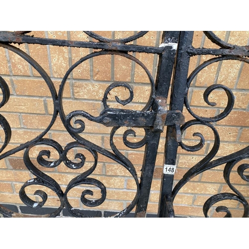 148 - A pair of wrought iron gates & posts Height 133cm x Width 260cm