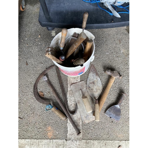 179 - A bucket including cement, plaster floats & other tools