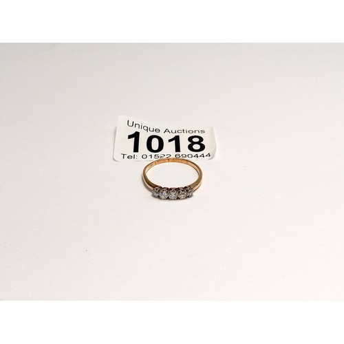 1018 - A five stone diamond ring, hall mark rubbed, size P, 2.1 grams.