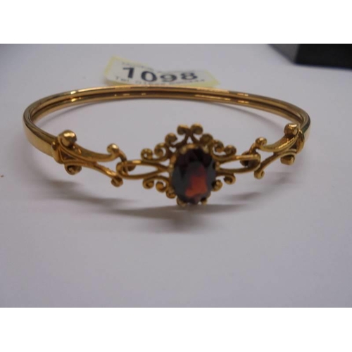 1098 - A 9ct gold bangle, 6.2 grams.