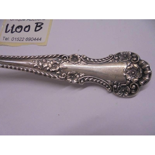 1100B - A sterling silver PAT 1899 salad serving fork, approximately 80 grams.