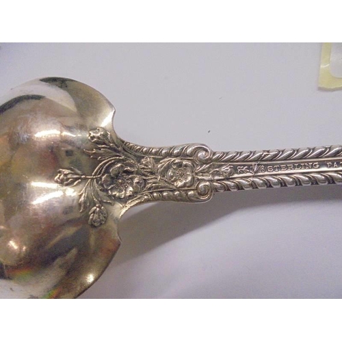 1100B - A sterling silver PAT 1899 salad serving fork, approximately 80 grams.