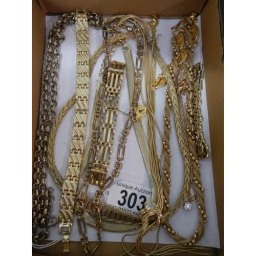 303 - Ten pieces of yellow metal jewellery (chains, necklaces and brooches).