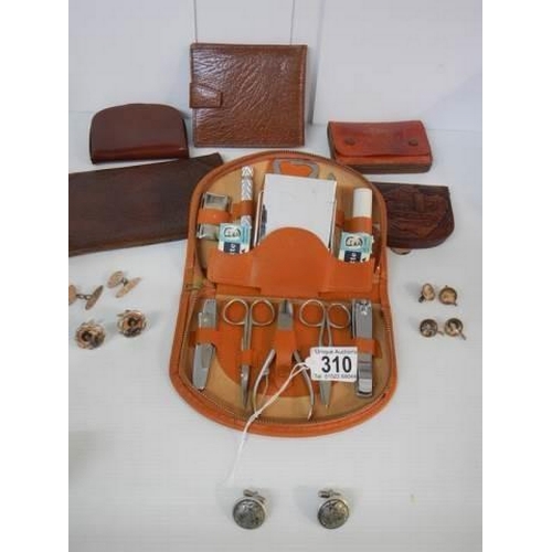 310 - A Gent's fitted vanity set, six leather wallets and five pairs of cuff links.