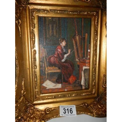 316 - A gilt framed study of a female artist, signed.