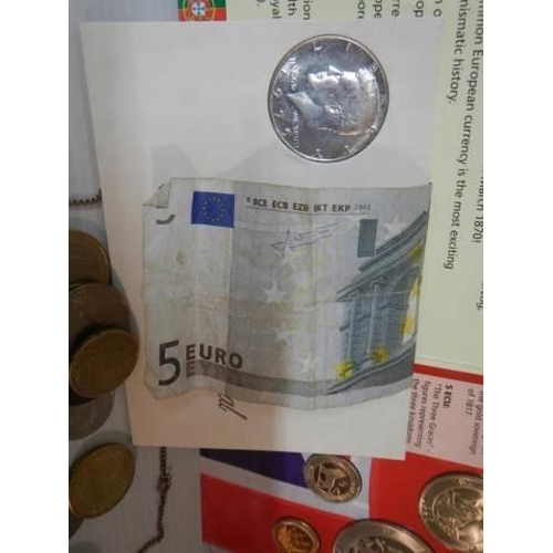 322 - A mixed lot of coins including £5 coin and six euro note etc.,