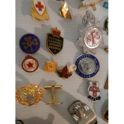 323 - A mixed lot of badges, whistles, brooches etc., (approximately 40 pieces)