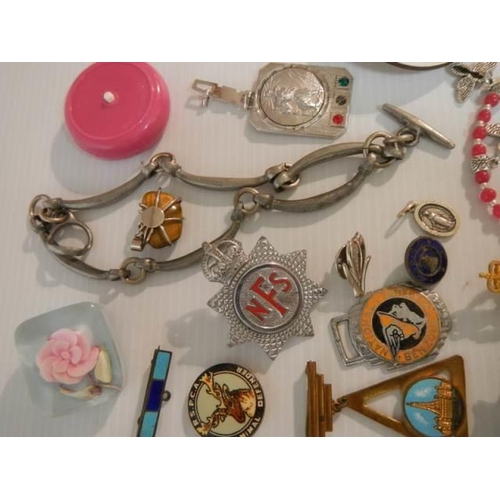 323 - A mixed lot of badges, whistles, brooches etc., (approximately 40 pieces)