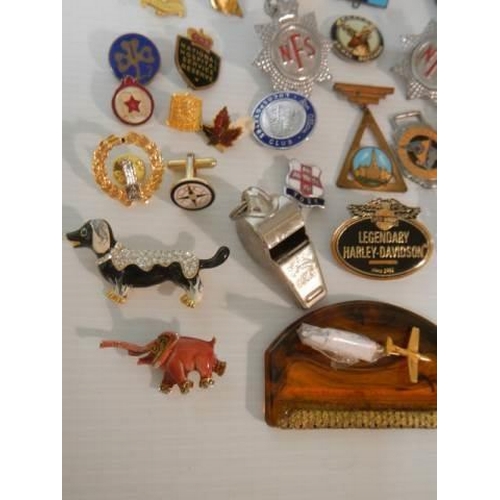 323 - A mixed lot of badges, whistles, brooches etc., (approximately 40 pieces)