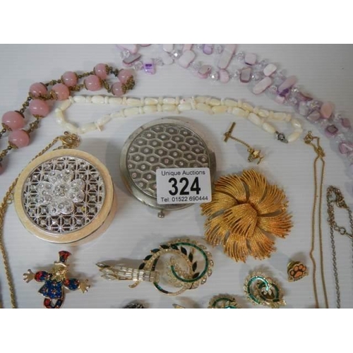 324 - A mixed lot of brooches, necklaces etc., (approximately 40 pieces).