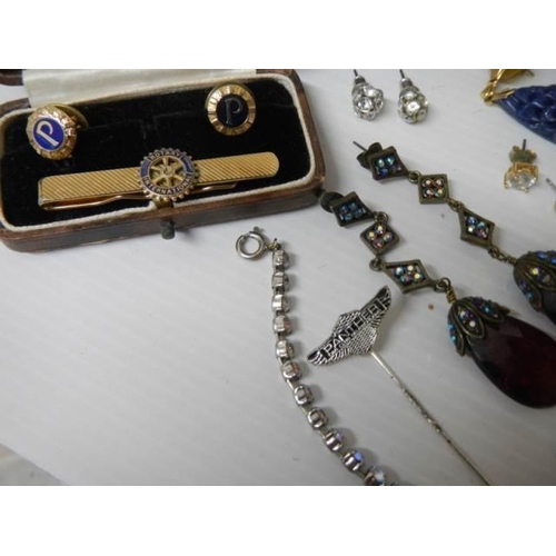 329 - A mixed lot including pendants with matching earrings, sets of buttons etc.,