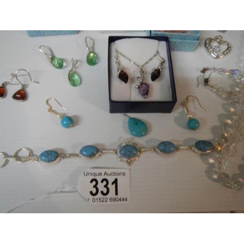 331 - A good lot of pendants, earrings and necklaces.