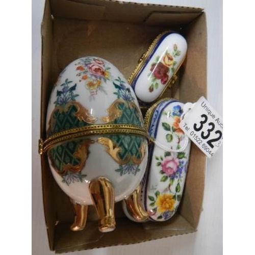 332 - Two porcelain patch boxes and an egg shaped trinket box.