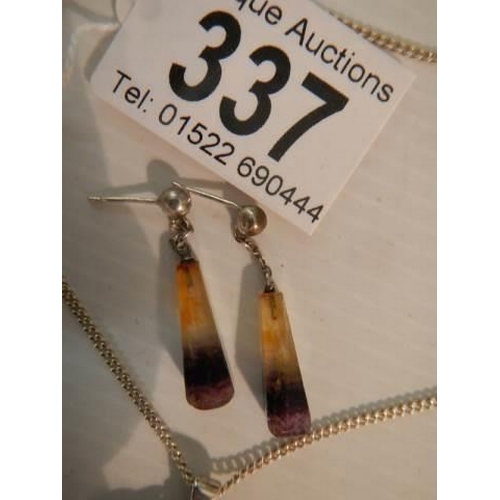 337 - A silver pendant set amber? and a pair of pendant earrings.