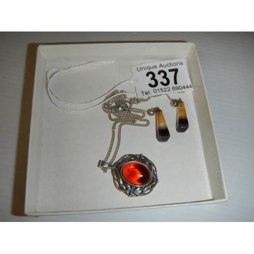 337 - A silver pendant set amber? and a pair of pendant earrings.