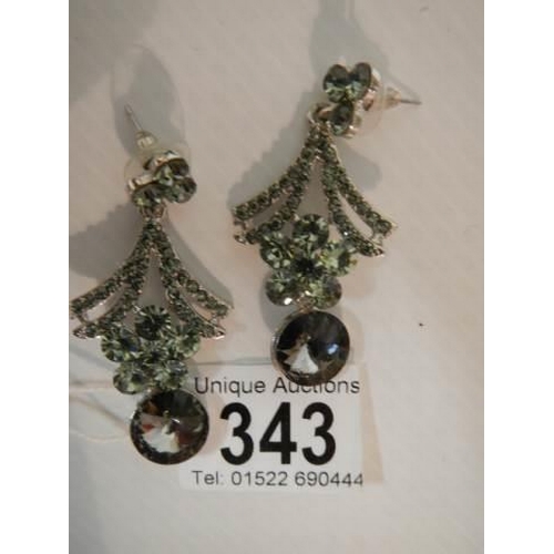 343 - A pair of diamonte pendant earrings.