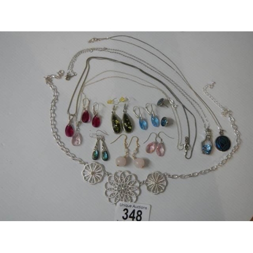 348 - A quantity of good quality earrings (some silver) and a pendant.