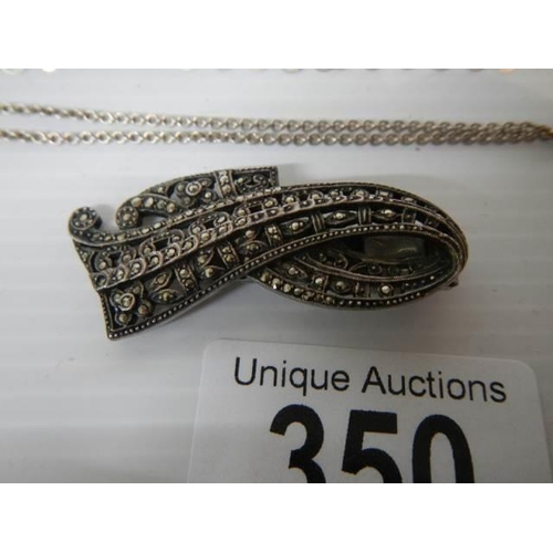 350 - Five silver chains, a silver bracelet, silver pendant, marcasite brooch etc.,