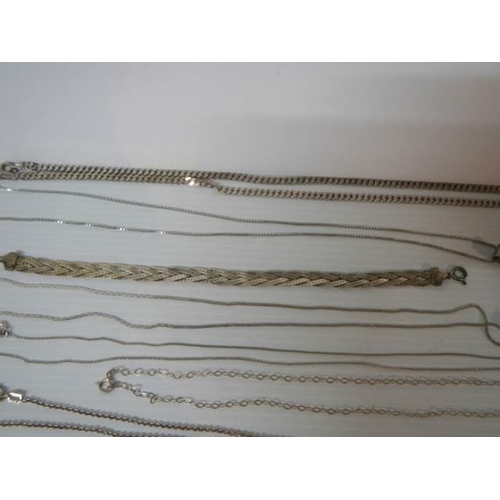 350 - Five silver chains, a silver bracelet, silver pendant, marcasite brooch etc.,