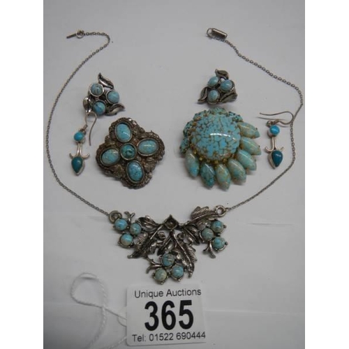 365 - A necklace, two brooches and two pairs of earrings set turquoise coloured stones.