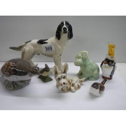 369 - Seven assorted animal figures including Beswick dog, Royal Copenhagen bird etc.,