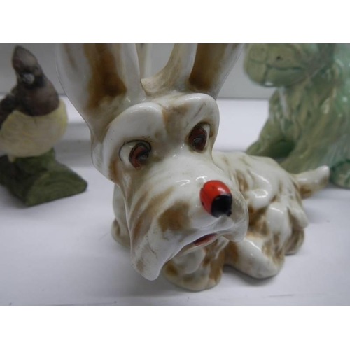 369 - Seven assorted animal figures including Beswick dog, Royal Copenhagen bird etc.,