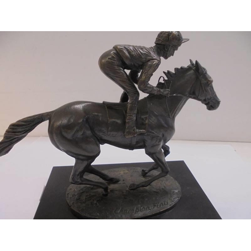 1213 - A signed bronze horse and jockey on a marble bases, signed David Cornell.