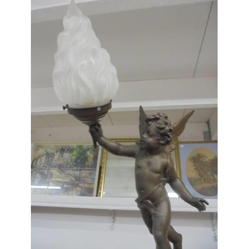 1217 - A Cherub table lamp with flame shade.