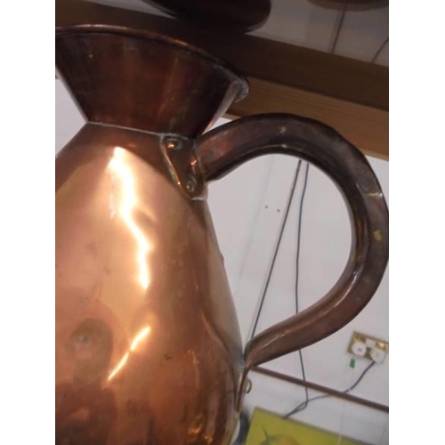 1220 - A large copper beer jug.