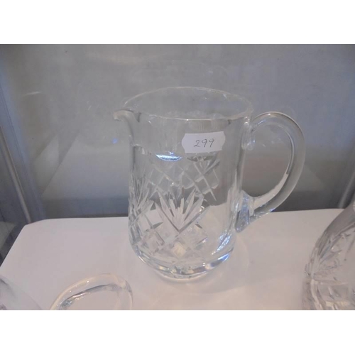 1251 - A good quality cut glass jug and three cut glass tankards.