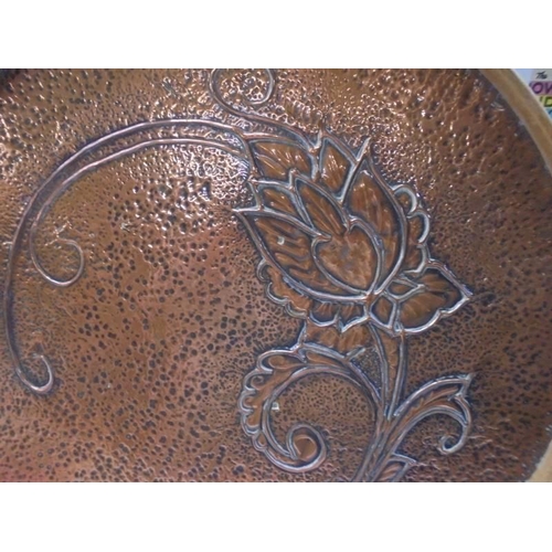 1278 - An Arts & Crafts hammered copper wood bound drinks tray, 35 cm diameter.