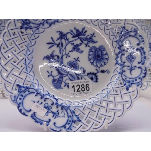 1286 - Three Meissen blue and white plates with reticulated borders.