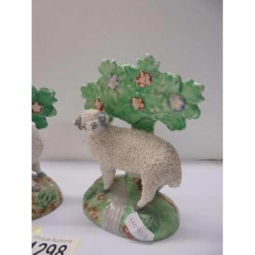 1298 - A good pair of Staffordshire ram and ewe sheep figures.