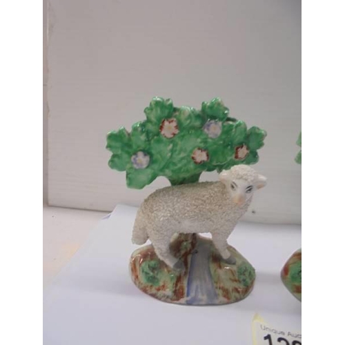 1298 - A good pair of Staffordshire ram and ewe sheep figures.