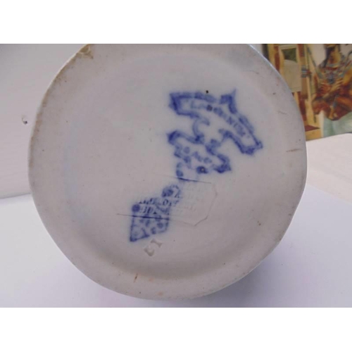 1299 - A 19th century blue and white jug with lozenge mark on base.