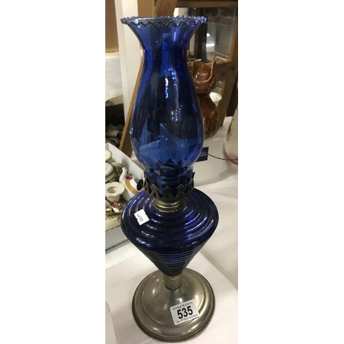 535 - A Oil lamp with blue glass shade