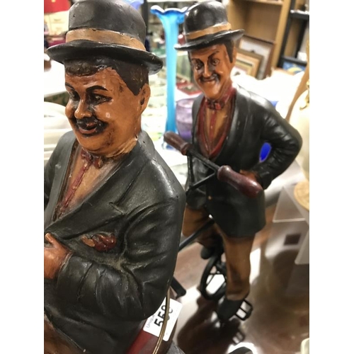 558 - Laurel and hardy figures on tricycle