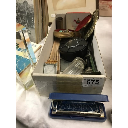 575 - A box of miscellaneous items including harmonica, pill box etc