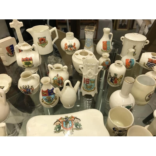 586 - A quantity of ceramic items with city and town crests