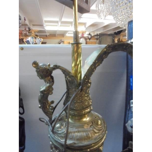 1424 - A heavy brass lamp in the form of a ewer, COLLECT ONLY.